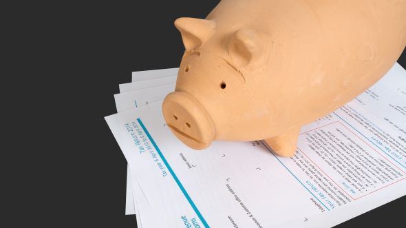 Piggy bank on letters
