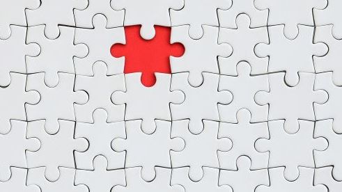 A completed puzzle missing a puzzle piece