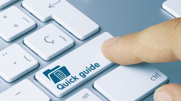 Finger pressing Quick Guide keyboard key