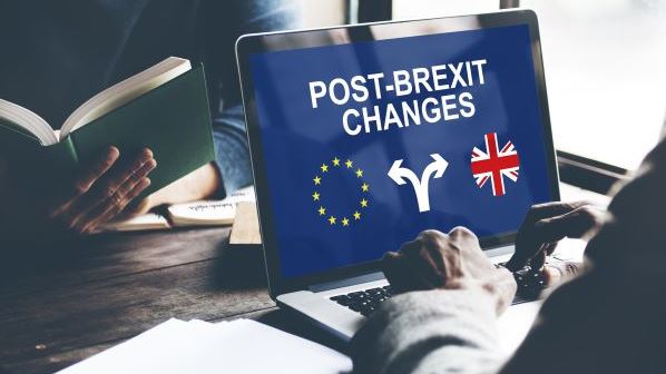 An R&D tax credit advisor on a laptop researching post-brexit changes to the R&D tax credit scheme