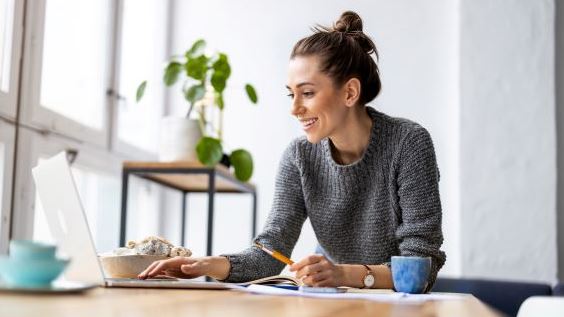 Women working in home office on laptop
