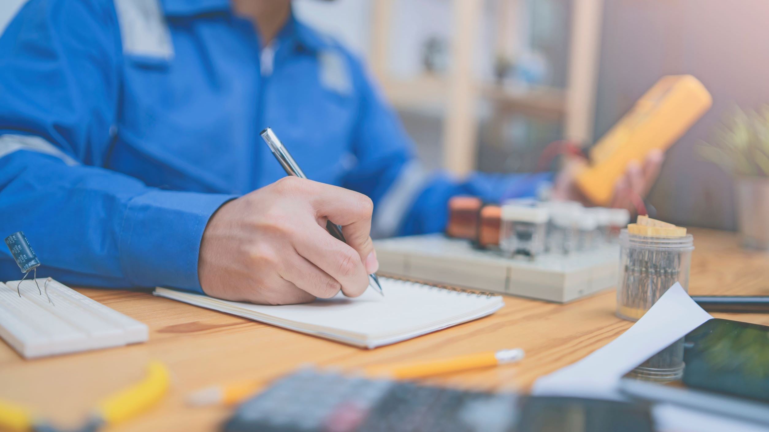 Man writing on a notepad