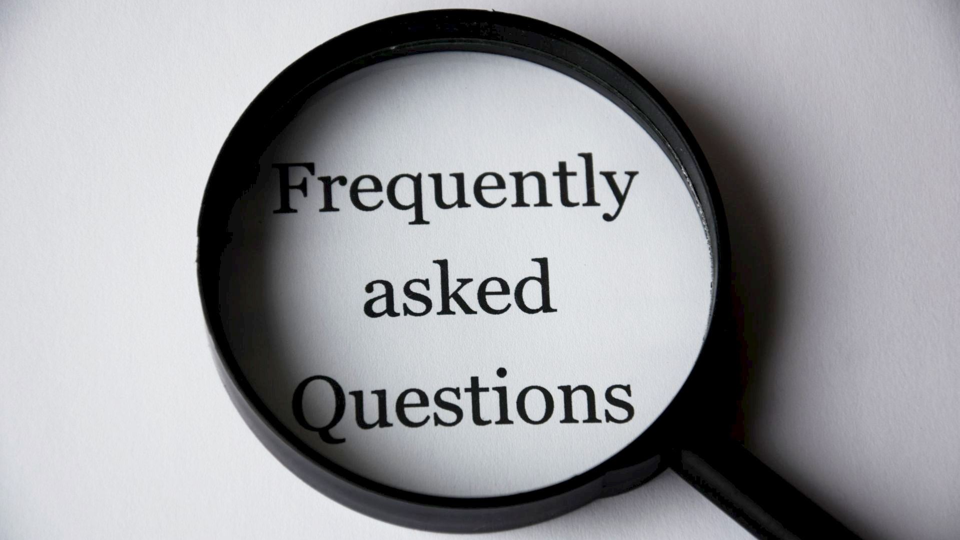 magnifying glass over the word 'Frequently asked Questions"