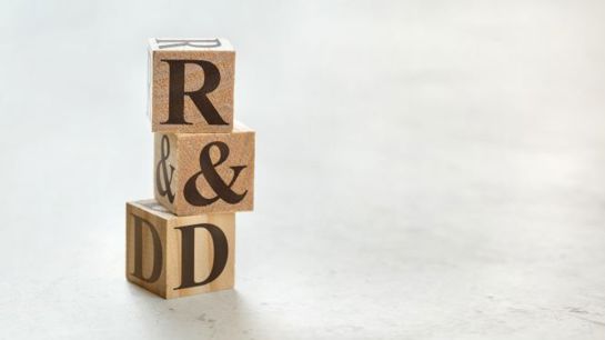 Letter blocks that spell "R&D"